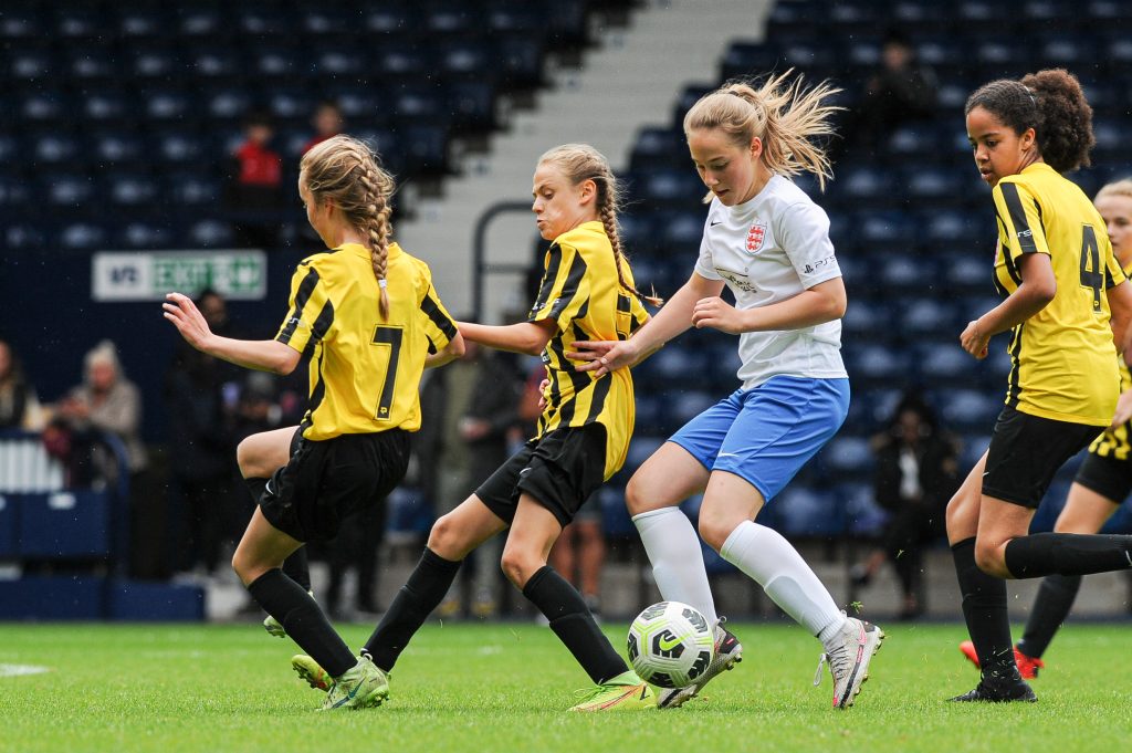 Girls taking part in a football match at West Bromwich Albion's Hawthorns stadium